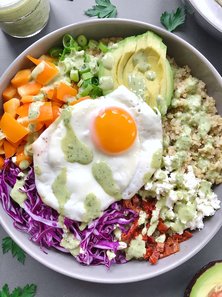 Made with a quinoa base, all the colorful veg, and a parsley-lemon green tahini sauce, this rainbow bowl is an explosion of freshness, texture, and flavor!